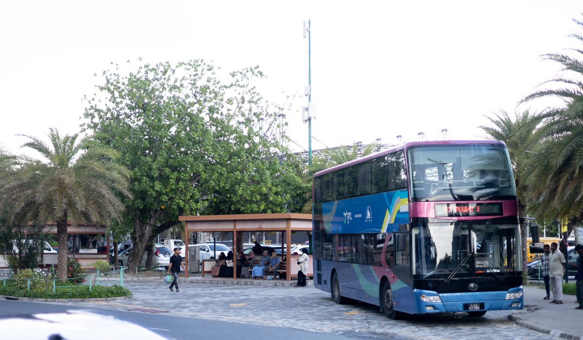 Bus travelling and bus stops around male