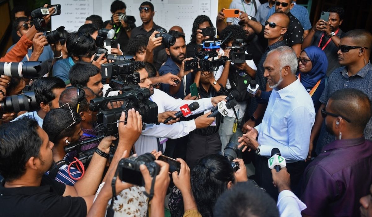Maldives' President Mohamed Muizzu (R) addresses the media representatives after casting his ballot during the country's parliamentary election, in Male on April 21, 2024. The Maldives votes in a parliamentary election likely to test Muizzu's tilt towards China and away from India, the luxury tourism hotspot's traditional benefactor. (Photo by Mohamed Afrah / AFP)